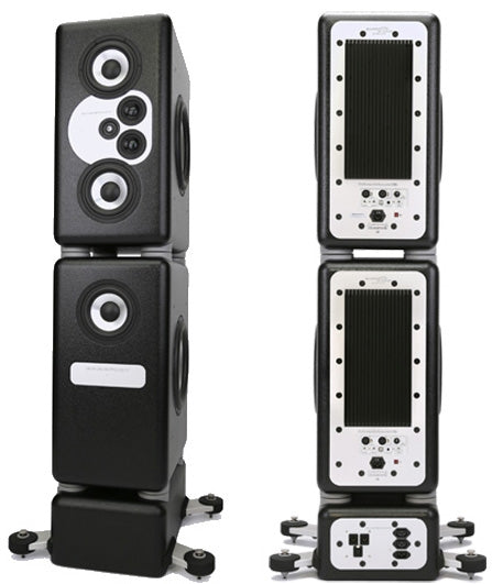 A tall black floor-standing modular tower studio monitor with ten exposed cone drivers of varying sizes stacked vertically in a sealed cabinet.