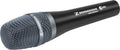 Close-up of a black Sennheiser microphone with a metal mesh grille and printed logos on the body.