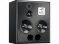 A large freestanding rectangular active studio monitor with two 12-inch bass drivers stacked vertically alongside a central dome midrange driver and a smaller dome tweeter mounted on the front baffle.