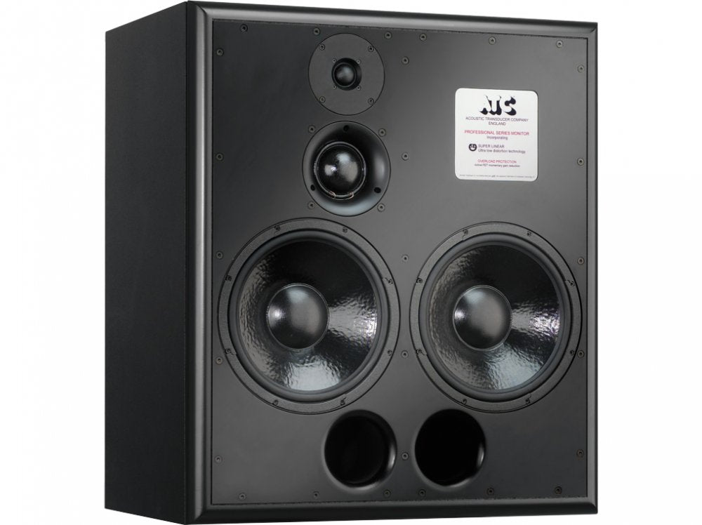 A large freestanding rectangular active studio monitor with two 12-inch bass drivers stacked vertically alongside a central dome midrange driver and a smaller dome tweeter mounted on the front baffle.
