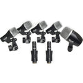 Seven black and silver microphones with mounting clips and XLR connectors arranged on a white background.