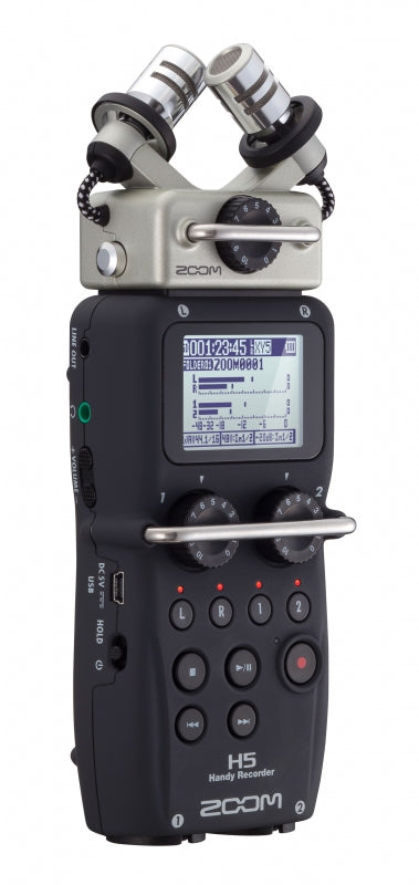 Handheld audio recorder with dual built-in microphones, LCD screen, rotary knobs, and various control buttons.