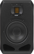 Front view of a black studio monitor speaker with a yellow folded diaphragm tweeter and large woofer driver.
