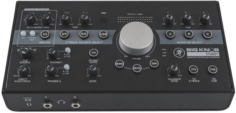 Black audio monitor controller interface with multiple knobs, buttons, and input/output jacks.