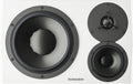 Front view of a white speaker with three drivers and DYNAUDIO brand text on the front.