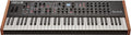 Black and wooden keyboard synthesizer with multiple knobs, buttons, and a small screen above the keys.