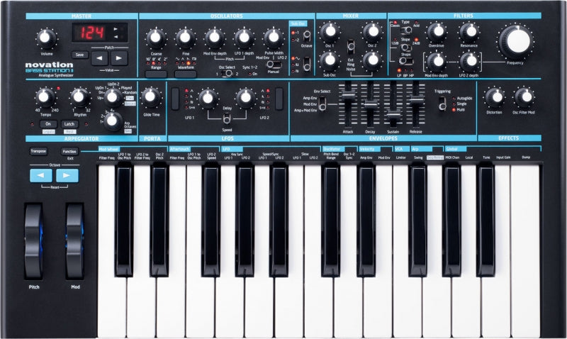 Black Novation Bass Station II analog synthesizer keyboard with numerous control knobs, faders, wheels, and LED display.