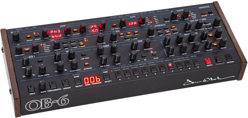 Black Oberheim OB-6 synthesizer module with wood side panels and multiple knobs, buttons, and LED displays.