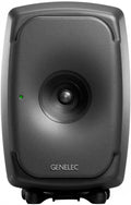 Front view of a black Genelec studio monitor speaker with a central speaker cone and green indicator light.