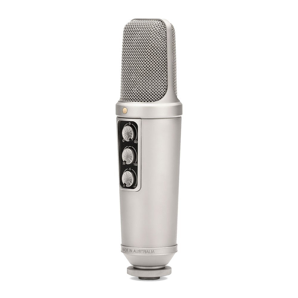 Silver studio microphone with three rotary knobs and a metallic mesh grille on top.