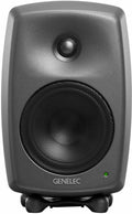 Front view of a black Genelec speaker with metal grille and green indicator light on the front.