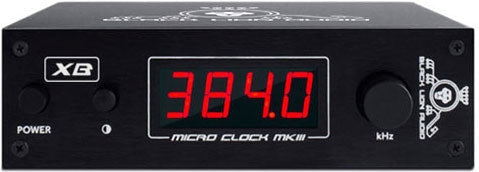 Black device with red digital display showing 384.0 and controls labeled power and XB
