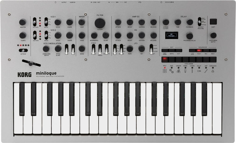 KORG minilogue synthesizer with keyboard, knobs, buttons, and display on gray surface.