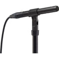 Black Sony microphone mounted on a stand with an XLR cable connected at the base.