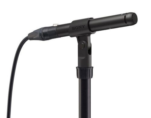 Black Sony microphone mounted on a stand with an XLR cable connected