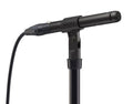 Black Sony microphone mounted on a stand with an XLR cable connected