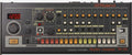 Roland TR-08 drum machine with multiple knobs, sliders, buttons, and a digital display showing 120.0.