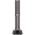 Gray shotgun microphone capsule with a rotary dial control and ZOOM brand text at the base.