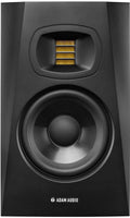 Front view of a black studio monitor speaker with a large woofer and a yellow ribbon tweeter.