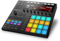 Black Native Instruments Maschine MK3 drum machine with colorful pads and dual display screens.