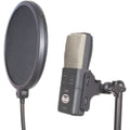 Black and silver USB microphone mounted with a black pop filter attached to a stand.