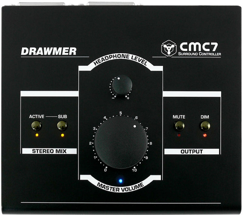 Black Drawmer CMC7 surround controller with rotary volume knobs and labeled LED indicators on a flat surface.