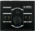 Black Drawmer CMC7 surround controller with rotary volume knobs and labeled LED indicators on a flat surface.