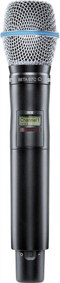 Handheld microphone with metal mesh grille, digital display showing Channel 1, and power switch.