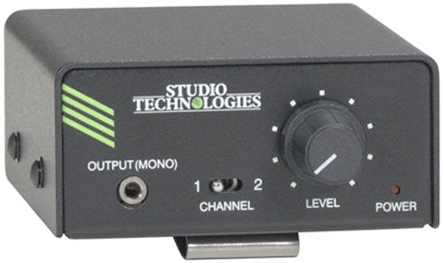 Black rectangular audio device with Studio Technologies branding, output jack, channel switch, level knob, and power indicator light.