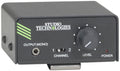 Black rectangular audio device with Studio Technologies branding, output jack, channel switch, level knob, and power indicator light.