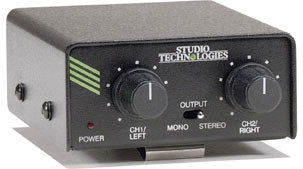 Black Studio Technologies amplifier with power switch and two output control knobs on front panel.