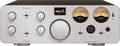 Silver audio amplifier front panel with rotary dials, toggle switches, VU meters, and headphone outputs.