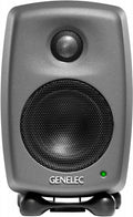 Front view of a gray Genelec studio monitor speaker with black speaker grilles and a green indicator light.