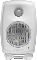 White Genelec studio monitor speaker with metal speaker grills and green LED indicator on front.