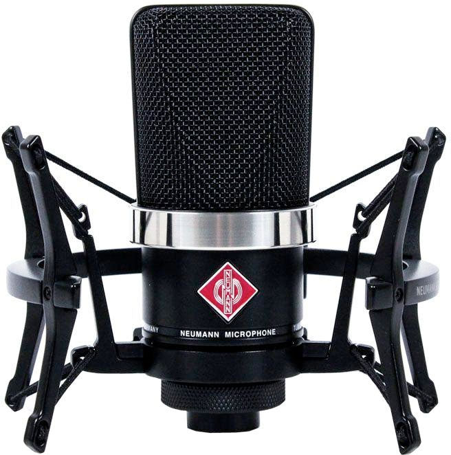 Front view of a black Neumann microphone with a shock mount and red logo on the front.