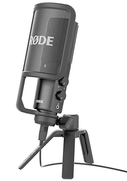 Black Rode microphone with pop filter mounted on a tripod with visible controls and USB cable connected.