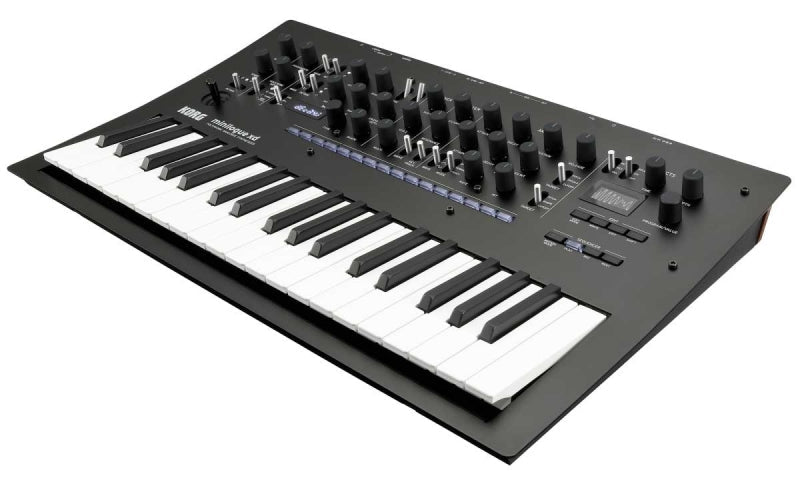 Black synthesizer with white and black keys, multiple knobs and slider switches, and a small display screen.