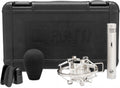 Silver cylindrical microphone with switch and accessories in front of a black carrying case with WARM AUDIO logo