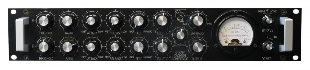 Front panel of a black audio processor with multiple silver knobs, toggle switches, and a large analog meter.