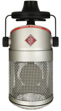 Silver and black Neumann branded microphone with metal mesh grille and red label ring.