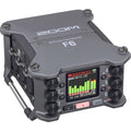 Zoom F6 multitrack field recorder with color display, multiple rotary knobs, and XLR inputs on the side.