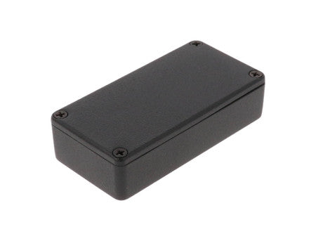 Black rectangular metal enclosure with a flat top and four screws in each corner on a white background.