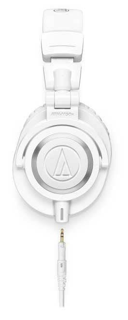 White over-ear headphones with a 3.5mm audio plug and visible Audio-Technica logo on ear cup.