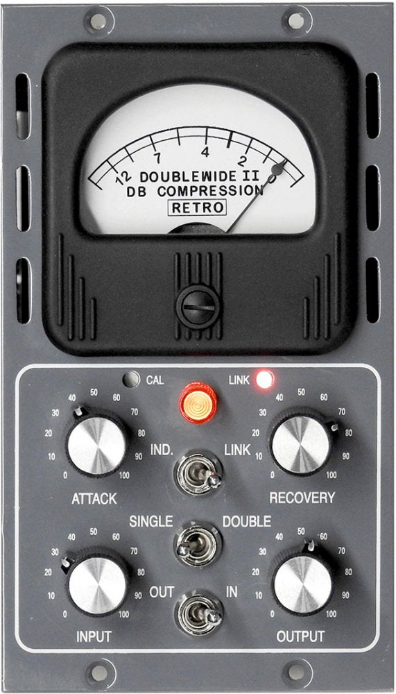 Front panel of a Doublewide II DB compression audio processor with meter, knobs, toggle switches, and indicator lights.