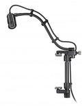 Black microphone with flexible mounting arm and clamp attached to a surface, featuring a foam windscreen and cable.