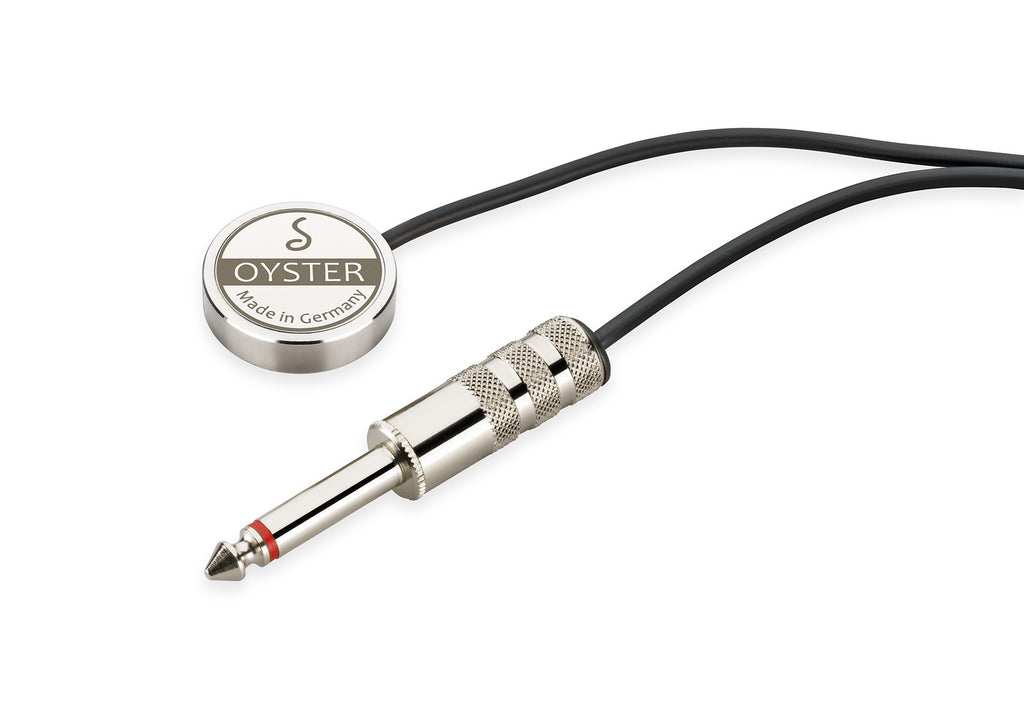 Round silver piezo pickup with logo and a black cable ending in a silver 1/4 inch jack plug.
