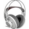 Gray and white over-ear headphones with padded ear cups and a brown headband suspension shown from angled side view.