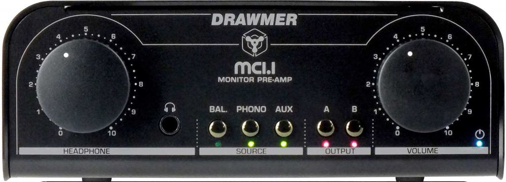 Black Drawmer MC1.1 monitor pre-amp with headphone jack, rotary knobs, and source/output buttons with indicator lights.