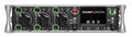 Front panel of a Sound Devices 833 audio mixer with multiple knobs, buttons, and a display screen.