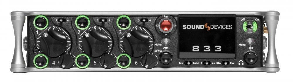 Front panel of a Sound Devices 833 audio mixer with multiple knobs, buttons, and a display screen.